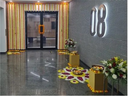 Professional corporate festive decorators dressing up an office floor lift lobby